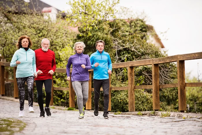 mature female runner A mature woman stops for a rest during a run