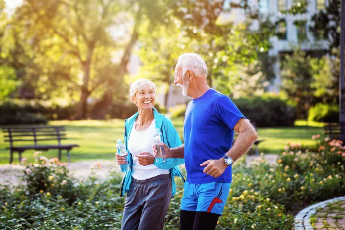 A mature woman stops for a rest during a run