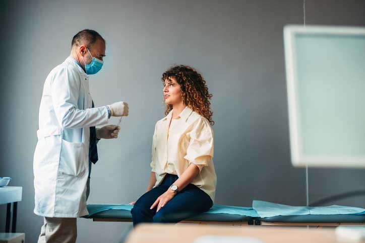 A medical professional following strict sterile safety protocols during a procedure.